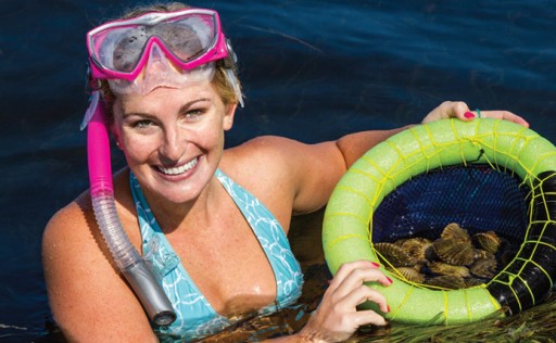 snorkeler showing off her bounty.