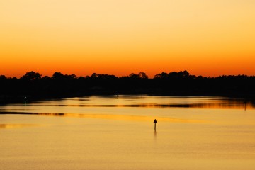 Image of the sun setting on the Apalachicola River.