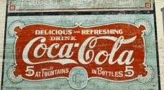 Image of the Coca-Cola mural painted on a building.