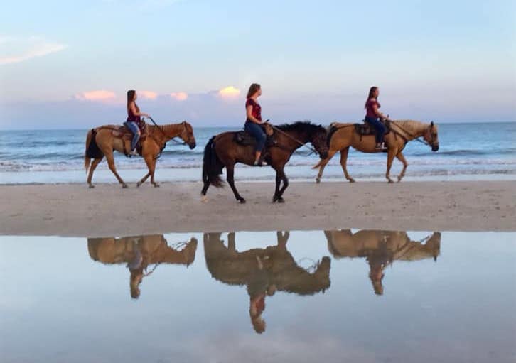 Image of horseback riding on the beach.