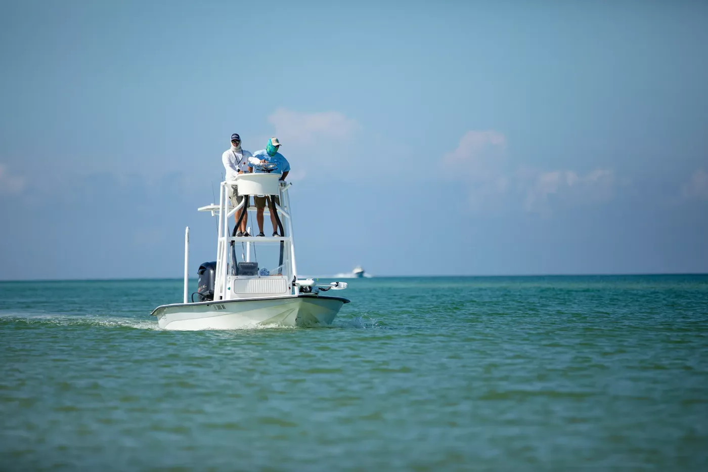 People fishing on a boat in the gulf.