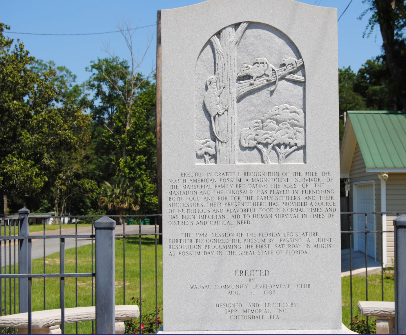 Possum Monument standing alone in Wausaw.