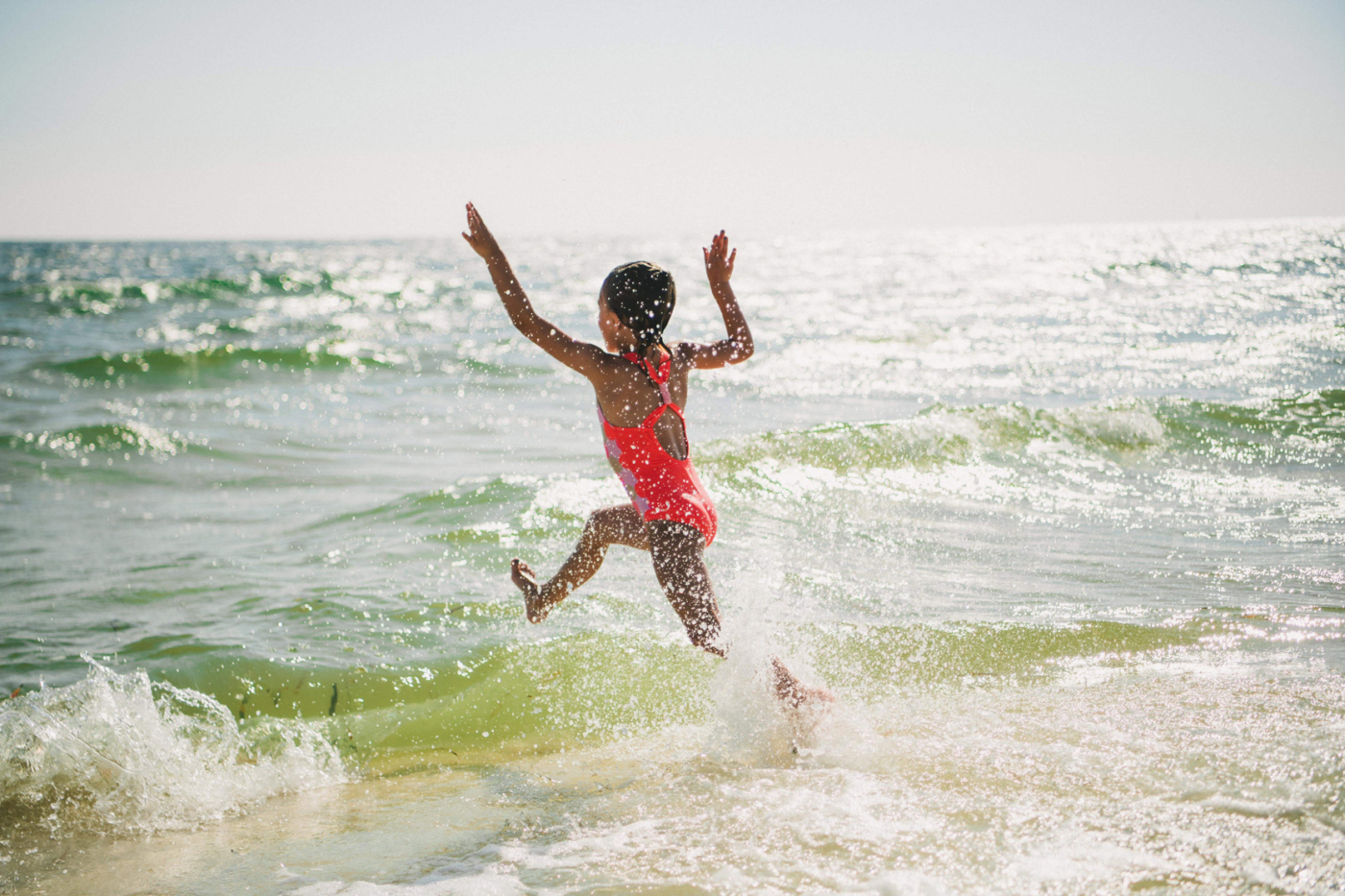 Image of young girl playing in water.