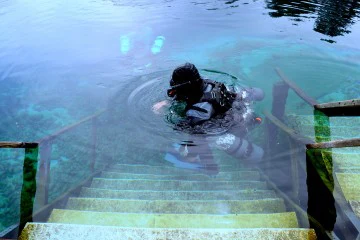 Image of a SCUBA diver in the water at Vortex Spring.